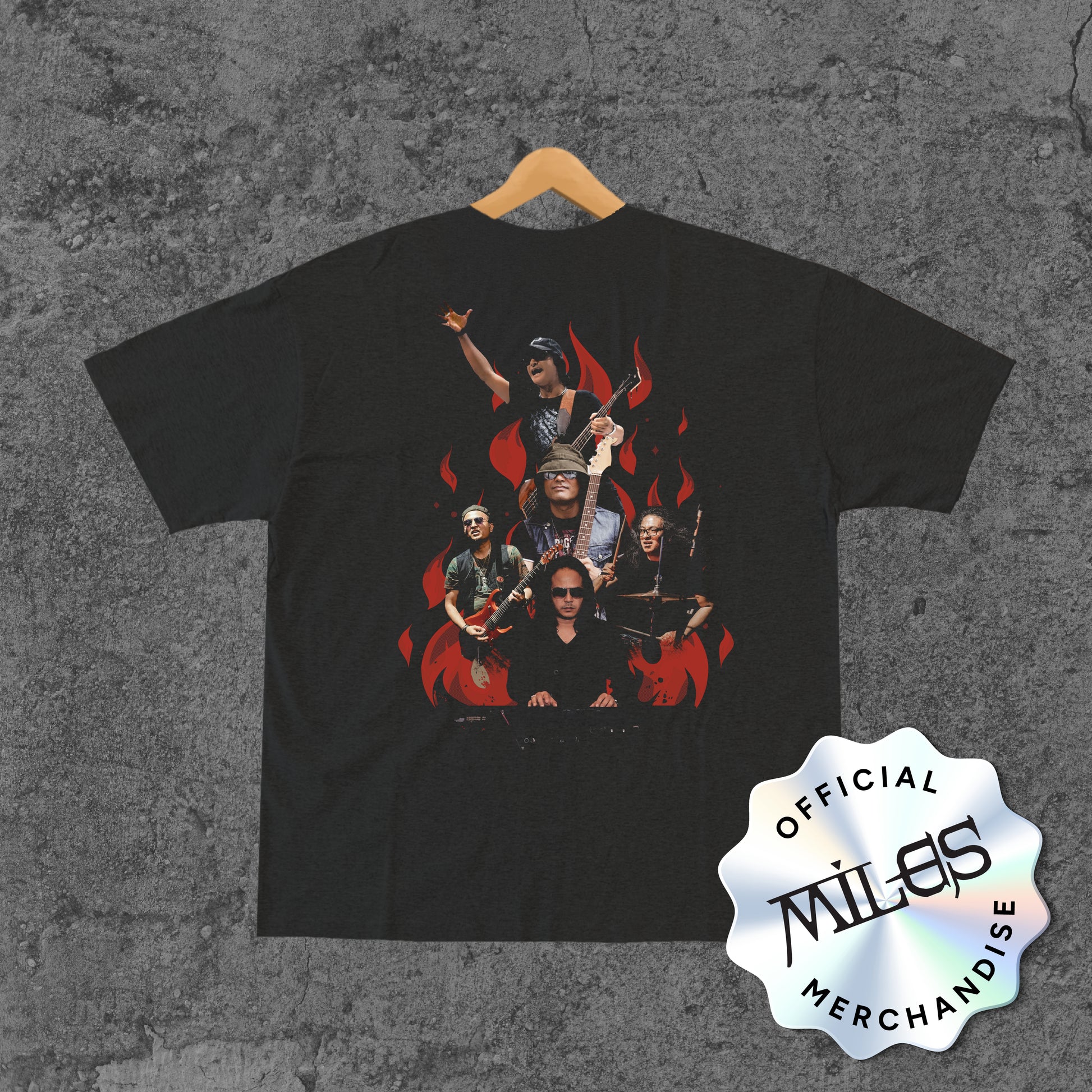 Black t-shirt with a graphic of a band on a textured gray background